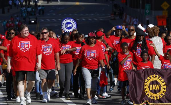 United Auto Workers members walk in the Labor Day parade' in Detroit, Monday, Sept. 2, 2019. United Auto Workers members walk in the Labor Day parade' in Detroit, Monday, Sept. 2, 2019.