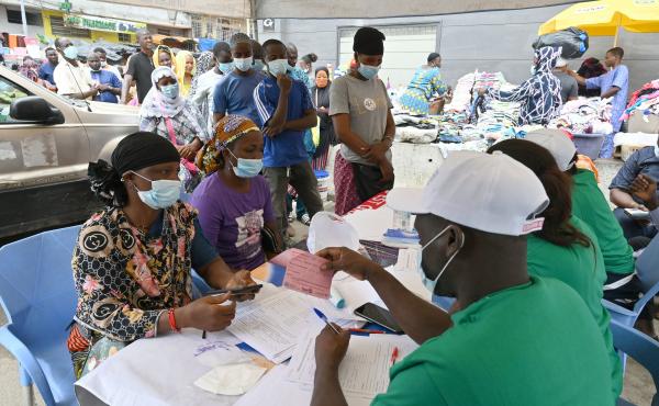 People line up to receive a Pfizer COVID-19 vaccine dose during a mass vaccination campaign in Abidjan, Ivory Coast, in August 2021. People line up to receive a Pfizer COVID-19 vaccine dose during a mass vaccination campaign in Abidjan, Ivory Coast, in August 2021.