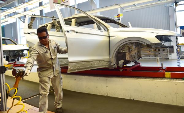 Employees work on the assembly line of the Tiguan model at the Volkswagen car plant in Puebla, central Mexico, in March. The auto sector is a key focus of the newly revised North American Free Trade Agreement. Employees work on the assembly line of the Tiguan model at the Volkswagen car plant in Puebla, central Mexico, in March. The auto sector is a key focus of the newly revised North American Free Trade Agreement.