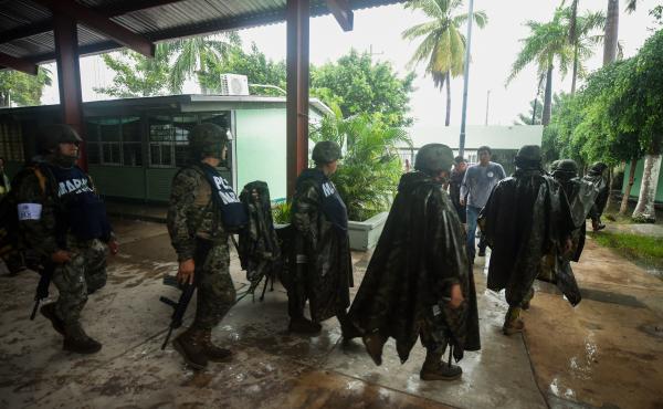 Mexican Marines guard a shelter in Escuinapa, Sinaloa state on Tuesday. Mexican Marines guard a shelter in Escuinapa, Sinaloa state on Tuesday.