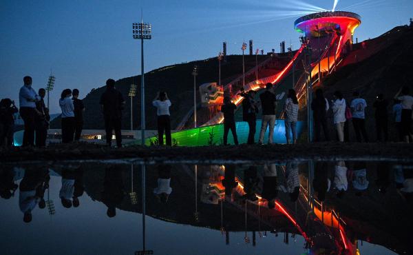 The Beijing Winter Olympics are set to open in February. Visitors recently watched a light show at the newly built ski jumping center in northern China's Hebei province. The Beijing Winter Olympics are set to open in February. Visitors recently watched a light show at the newly built ski jumping center in northern China's Hebei province.