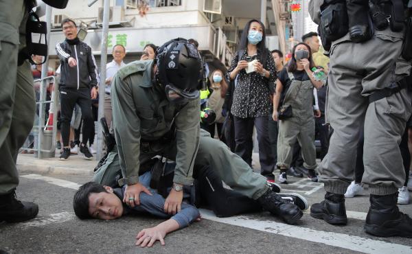 A protester is detained in Hong Kong Nov. 11, 2019. Hong Kong is in the sixth month of protests that began in June over a proposed extradition law and grown to include other grievances. A protester is detained in Hong Kong Nov. 11, 2019. Hong Kong is in the sixth month of protests that began in June over a proposed extradition law and grown to include other grievances.