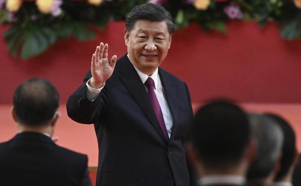 China's President Xi Jinping waves following his speech after a ceremony to inaugurate the city's new government in Hong Kong Friday, July 1, 2022, on the 25th anniversary of the city's handover from Britain to China. China's President Xi Jinping waves following his speech after a ceremony to inaugurate the city's new government in Hong Kong Friday, July 1, 2022, on the 25th anniversary of the city's handover from Britain to China.