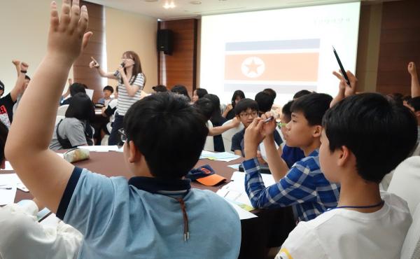 The eighth and ninth graders at a recent Unification Leader Camp in Jeju, South Korea, answer questions about their knowledge of their neighbors to the North. The eighth and ninth graders at a recent Unification Leader Camp in Jeju, South Korea, answer questions about their knowledge of their neighbors to the North.
