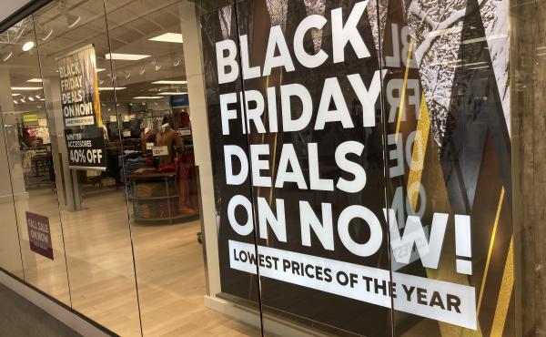 A sign promote sales at a clothing store in a Colorado mall. A sign promote sales at a clothing store in a Colorado mall.