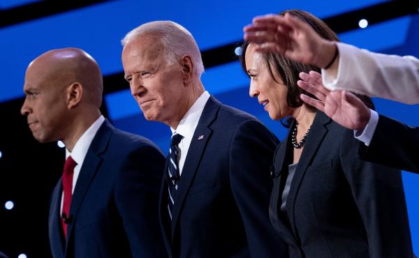 Democratic presidential hopefuls (from left): Sen. Cory Booker, D-N.J., former Vice President Joe Biden, and Sen. Kamala Harris, D-Calif., onstage before the July debate. Democratic presidential hopefuls (from left): Sen. Cory Booker, D-N.J., former Vice President Joe Biden, and Sen. Kamala Harris, D-Calif., onstage before the July debate.