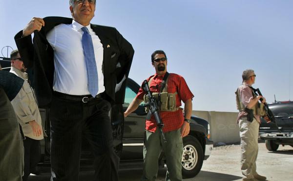 Blackwater security contractors guard Zalmay Khalilzad, then the U.S. ambassador to Iraq, as he arrives at a community sports center in Baghdad in 2006. Blackwater security contractors guard Zalmay Khalilzad, then the U.S. ambassador to Iraq, as he arrives at a community sports center in Baghdad in 2006.