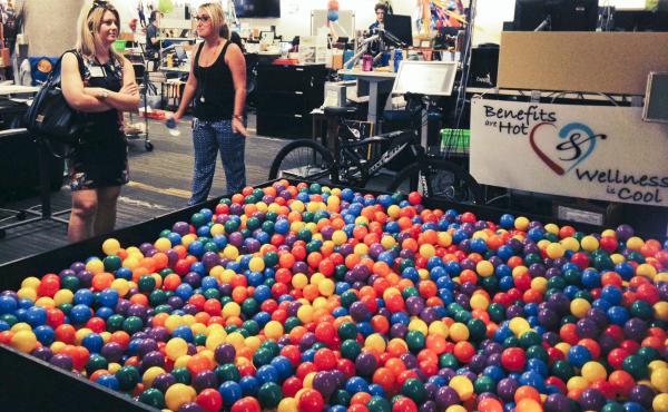 Zappos.com tour guide Erika Newman (right) shows off the ball pit in the human resources department of the company's Las Vegas headquarters. Zappos eliminated managers and embraced a system of self-governance known as holacracy. Zappos.com tour guide Erika Newman (right) shows off the ball pit in the human resources department of the company's Las Vegas headquarters. Zappos eliminated managers and embraced a system of self-governance known as holacracy.