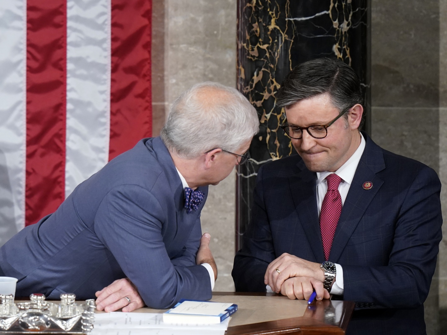 Temporary House speaker Rep. Patrick McHenry, R-N.C., talks with Rep. Mike Johnson, R-La., before Republicans try to elect Johnson to be the new House speaker, at the Capitol in Washington on Wednesday.