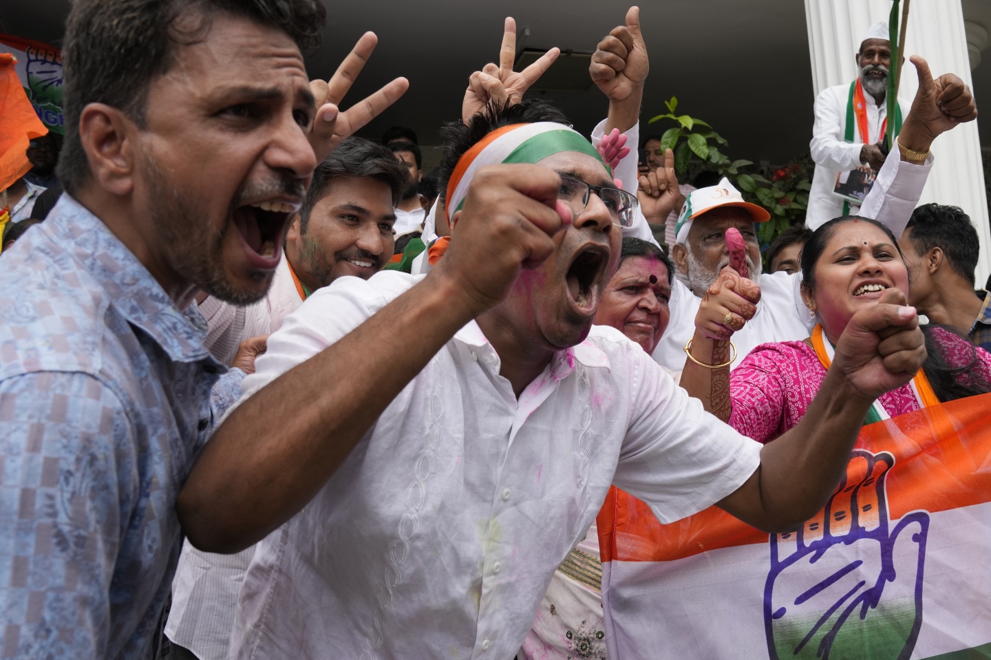 Supporters of the opposition Congress party celebrate early leads in the Karnataka state elections in Bengaluru, India, on Saturday.