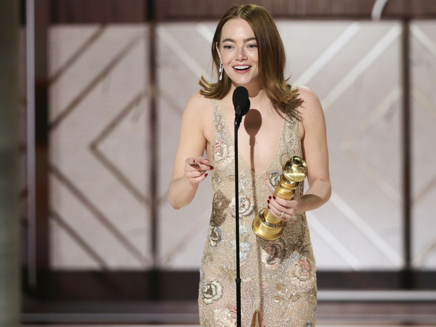 This image released by CBS shows Emma Stone accepting the award for best female actor in a motion picture for her role in "Poor Things" during the 81st Annual Golden Globe Awards in Beverly Hills, Calif., on Sunday, Jan. 7, 2024.